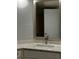 Updated bathroom with granite countertop and modern sink at 67 Country Club Dr, Largo, FL 33771