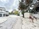 Spacious backyard with white privacy fence, brick path and white stone groundcover, perfect for entertaining at 6710 Myrna Dr, Tampa, FL 33619