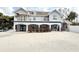 View of home's exterior and backyard, featuring a sandy yard and pool at 6710 Myrna Dr, Tampa, FL 33619