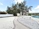 Lovely backyard featuring a winding brick path and well-manicured landscaping, and a white storage shed at 6710 Myrna Dr, Tampa, FL 33619