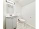 Bathroom featuring a vanity with gray cabinetry, commode and shower at 6710 Myrna Dr, Tampa, FL 33619