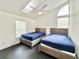 Bedroom features two beds, high ceilings and a skylight at 6710 Myrna Dr, Tampa, FL 33619