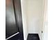 Small closet with black tile floor and white walls at 6710 Myrna Dr, Tampa, FL 33619