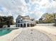 Charming two-story home featuring a pool and white rock landscaping at 6710 Myrna Dr, Tampa, FL 33619