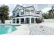 Charming two-story home featuring a pool and white rock landscaping at 6710 Myrna Dr, Tampa, FL 33619