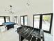 Game room featuring a foosball table, pool table and access to outdoor pool area at 6710 Myrna Dr, Tampa, FL 33619