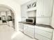 Bright kitchen features white cabinetry, granite countertops, and stainless steel appliances at 6710 Myrna Dr, Tampa, FL 33619