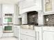 Close-up showcasing the gas range, oven, and cabinetry in the updated kitchen with stainless steel accents at 6710 Myrna Dr, Tampa, FL 33619