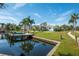 Lovely waterfront property showcasing a private dock and canal views at 5823 Dory Way, Tampa, FL 33615