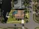 Aerial view of a single-Gathering home with a pool and canal access at 5823 Dory Way, Tampa, FL 33615