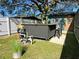 Backyard with bar, grassy area, and pool equipment at 4412 W Pearl Ave, Tampa, FL 33611