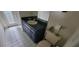 Bathroom featuring tile flooring, a single sink vanity, and a toilet at 4467 Worthington Ct, Palm Harbor, FL 34685