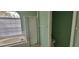 Bathroom showcasing a soaking tub, glass-enclosed shower, and a large window, creating a spa-like atmosphere at 4467 Worthington Ct, Palm Harbor, FL 34685