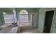 Bright bathroom featuring a soaking tub, walk-in shower, and double sink vanity at 4467 Worthington Ct, Palm Harbor, FL 34685