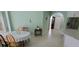 Dining Area featuring tile flooring, table with chairs, and a small decorative table at 4467 Worthington Ct, Palm Harbor, FL 34685