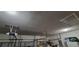 Spacious garage featuring high ceilings, a garage door opener, and ample storage space at 4467 Worthington Ct, Palm Harbor, FL 34685
