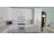 Beautiful kitchen with white cabinets, a peninsula island, and stainless steel appliances at 4467 Worthington Ct, Palm Harbor, FL 34685