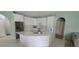 Beautiful kitchen with white cabinets, stainless appliances, and open layout perfect for entertaining at 4467 Worthington Ct, Palm Harbor, FL 34685