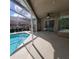 Covered patio featuring a pool, ceiling fan, and beautiful outdoor space at 4467 Worthington Ct, Palm Harbor, FL 34685