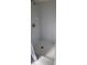 Shower featuring white tile and flooring at 4467 Worthington Ct, Palm Harbor, FL 34685