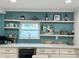 Bright bar area features stylish shelving, modern countertops, white cabinets, and a wine cooler at 4810 Chancellor Ne St, St Petersburg, FL 33703