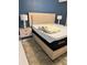 This bedroom offers a bed with a nightstand, lamp and carpeted floor at 4810 Chancellor Ne St, St Petersburg, FL 33703