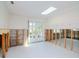 Bright dining area with double doors to the backyard and a skylight needing drywall and renovation at 4810 Chancellor Ne St, St Petersburg, FL 33703