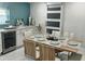 Dining room features a set table, sliding door, built in wine cooler and modern decor at 4810 Chancellor Ne St, St Petersburg, FL 33703
