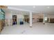 Large living space with tile floors, framed walls, bright lighting, and adjacent rooms, needing drywall and renovation at 4810 Chancellor Ne St, St Petersburg, FL 33703