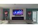 Cozy living room showcases a modern fireplace with a large screen TV and Valentine's Day decorations at 4810 Chancellor Ne St, St Petersburg, FL 33703
