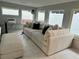 Spacious living room with a large sectional sofa, bright windows and modern decor at 4810 Chancellor Ne St, St Petersburg, FL 33703