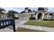 Two-car garage and front yard landscaping at 4467 Worthington Ct, Palm Harbor, FL 34685