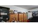 Garage with storage cabinets and various items at 4467 Worthington Ct, Palm Harbor, FL 34685