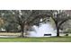 Serene fountain scene with benches, nestled amongst trees at 4467 Worthington Ct, Palm Harbor, FL 34685