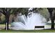 Relaxing water fountain with benches near pond at 4467 Worthington Ct, Palm Harbor, FL 34685