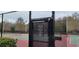 Tennis court entrance with key required for access at 4467 Worthington Ct, Palm Harbor, FL 34685
