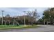Community playground next to a tennis court at 4467 Worthington Ct, Palm Harbor, FL 34685