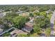 Aerial view of a house and surrounding neighborhood, showcasing the property's location and landscape at 1765 Thames St, Clearwater, FL 33755