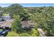 Aerial view of a single-story house with a large yard and mature trees at 1765 Thames St, Clearwater, FL 33755