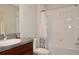 Clean bathroom with a shower/tub combo and granite vanity at 13461 Marble Sands Ct, Hudson, FL 34669