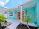 Charming beach cottage with coral exterior and double doors at 4810 Chancellor Ne St, St Petersburg, FL 33703