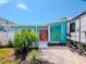 Bright teal home with walkway, landscaping, and RV parking at 4810 Chancellor Ne St, St Petersburg, FL 33703