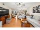 Living room with sectional sofa and hardwood floors at 3399 Mermoor Dr # 207, Palm Harbor, FL 34685