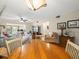 Dining area with round wood table and four chairs, open to living room at 3399 Mermoor Dr # 207, Palm Harbor, FL 34685