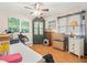 Second bedroom with wood floors and ceiling fan at 3399 Mermoor Dr # 207, Palm Harbor, FL 34685