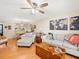 Living room with sectional sofa and wood floors at 3399 Mermoor Dr # 207, Palm Harbor, FL 34685