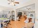 Open living room with hardwood floors and high ceilings at 3399 Mermoor Dr # 207, Palm Harbor, FL 34685