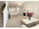 Spacious living room with a fireplace and view to kitchen and stairs at 10823 Verawood Dr, Riverview, FL 33579