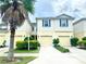 Two-story townhome with a charming facade and a two-car garage at 10823 Verawood Dr, Riverview, FL 33579