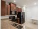 Modern kitchen with stainless steel appliances and granite countertops at 10823 Verawood Dr, Riverview, FL 33579